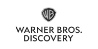 The Warner Bros. Discovery logo, featuring a black and white WB shield above the company name in bold capital letters on a white background.